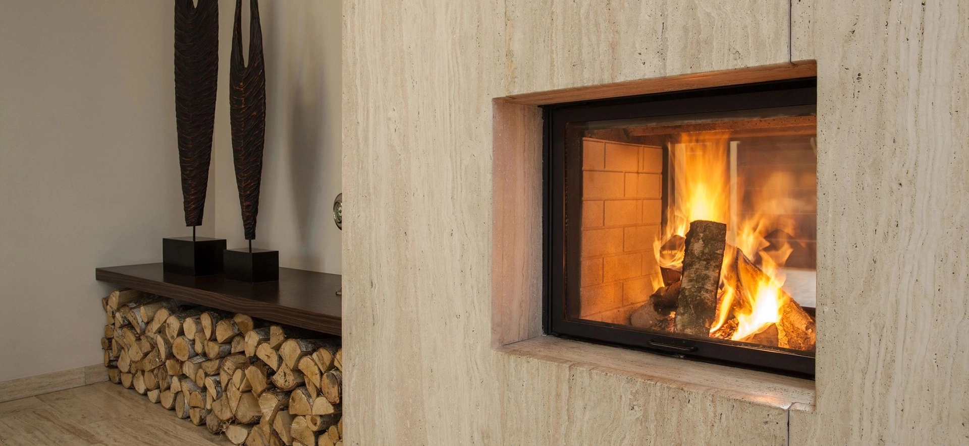 A fireplace with wood burning in it